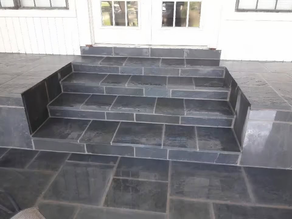 Stone landscaping and hardscape work on a North Texas property